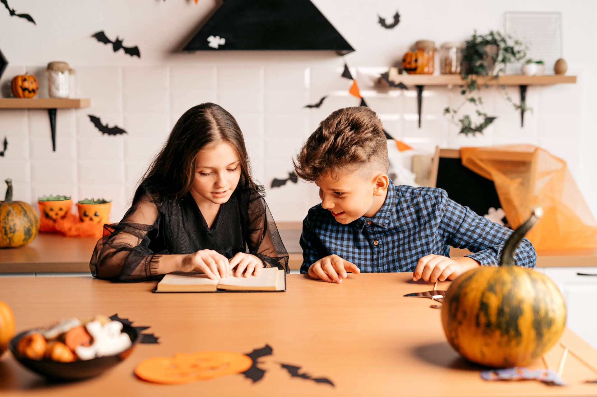 Crafting with kids: Learn how to create spooky bats or vampire costumes for Halloween from simple materials.